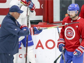 Canadiens head coach Claude Julien speaks to Tomas Tatar during training camp practice at the Bell Sports Complex in Brossard on Sept. 14, 2018.