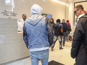 Customers visit the Société québécoise du cannabis store on St-Catherine St. W. on Oct. 17, 2018 — the day recreational marijuana was made legal in Canada.