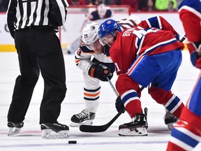 Leon Draisaitl of the Edmonton Oilers and Canadiens' Paul Byron take a face-off at the Bell Centre on Sunday, Feb. 3, 2019, in Montreal.