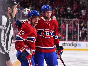 Canadiens' Max Domi, left,   celebrates a second-period goal with teammate Jeff Petry against the Edmonton Oilers at the Bell Centre on Sunday, Feb. 3, 2019, in Montreal.