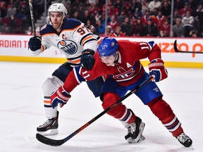 Brendan Gallagher of the Montreal Canadiens and Connor McDavid of the Edmonton Oilers battle at the Bell Centre in Montreal on Feb. 3, 2019.