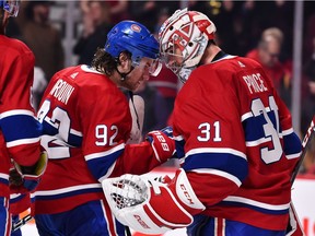 The Canadiens’ Jonathan Drouin congratulates goalie Carey Price after 5-2 victory over the Winnipeg Jets during NHL game at the Bell Centre in Montreal on Thursday, Feb. 7, 2019.