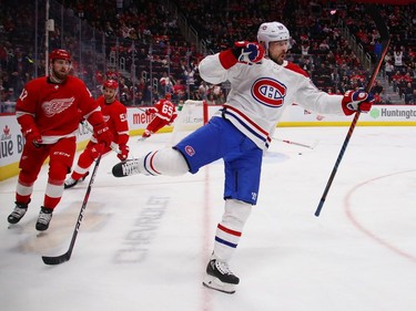 Tomas Tatar #90 of the Montreal Canadiens celebrates his first period goal next to Filip Hronek #17 of the Detroit Red Wings at Little Caesars Arena on February 26, 2019 in Detroit, Michigan.