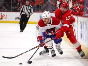 Andrew Shaw of the Montreal Canadiens battles for the puck with Filip Hronek of the Detroit Red Wings during the first period at Little Caesars Arena on Feb. 26, 2019, in Detroit.