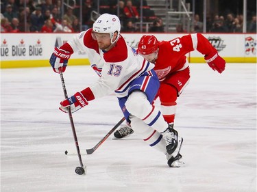 Max Domi #13 of the Montreal Canadiens heads up ice in front of Jordan Weal #43 of the Montreal Canadiens during the third period at Little Caesars Arena on February 26, 2019 in Detroit, Michigan.