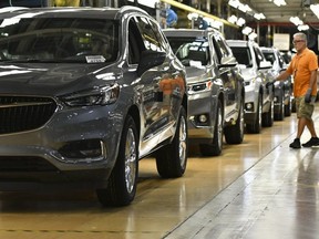 Buicks roll off the line at General Motors' Lansing Delta Township Assembly Plant in Delta Township, Mich., on June 19, 2018.