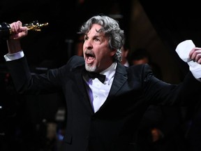 Director Peter Farrelly, winner of Best Picture and Best Original Screenplay for "Green Book," exults at the 91st Annual Academy Awards.