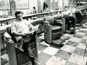 This photograph was taken to illustrate a story about a cold snap that was keeping customers away. The original cutline said: "Barbers are among those whose businesses are suffering — not only from long hairs but from cold weather."