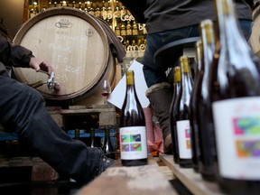 A wine grower bottles Beaujolais Nouveau in Paris in 2013 in Paris.