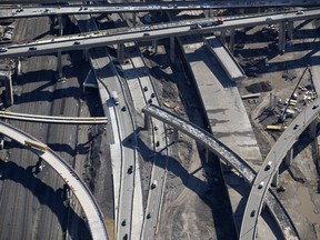 The Turcot Interchange is seen in an aerial view in July 2018. The portion of Highway 15 south to Highway 20 west is seen partially demolished.