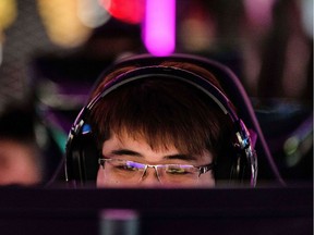In this picture taken on January 29, 2019, a man reacts as he uses a console at the Cyber Games Arena (CGA) eSports venue in the Mongkok district of Kowloon in Hong Kong. - At 25,000 square feet (2,322 sq. metres), the Cyber Games Arena (CGA) claims to be the largest integrated eSports stadium in Asia. (Photo by Anthony WALLACE / AFP)ANTHONY WALLACE/AFP/Getty Images