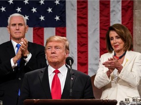 US President Donald Trump delivers the State of the Union address Tuesday night. At right, Speaker of the House Nancy Pelosi applauds politely.