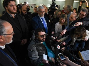 Aymen Derbali, a victim in the Quebec mosque attack, talks to the press after Friday's sentence was handed down.