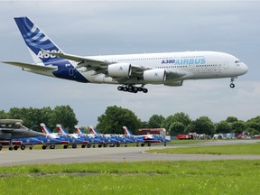 (FILES) This file photo taken on June 20, 2009 shows an Airbus A380 landing during the 48th international Paris Air Show. - European aerospace giant Airbus said on February 14, 2019 it would end production of the A380 superjumbo, the double-decker jet which earned plaudits from passengers but failed to win over enough airlines to justify its massive costs.