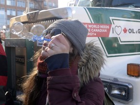 A protester blows bubbles as a convoy of angry Albertans and other westerners rolled up to Parliament Hill in Ottawa, Tuesday, Feb.19, 2019 to protest federal energy and environmental policies.
