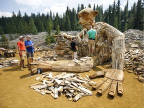 In this Aug. 7, 2018, photo, a 15-foot-high troll sculpture is under construction along a trail in Breckenridge, Colo.