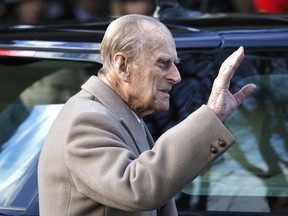 In this Dec. 25, 2016, file photo, Britain's Prince Philip waves to the public as he leaves after attending a Christmas day church service in Sandringham, England.