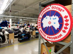 Employees work on Canada Goose jackets at the factory in Toronto. The parka maker is opening a new factory in Quebec.