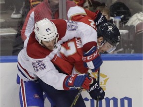 Canadiens' Andrew Shaw and Florida Panthers' Denis Malgin battle for the puck on Sunday, Feb. 17, 2019, in Sunrise, Fla.