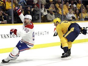 Montreal Canadiens left wing Tomas Tatar (90) celebrates after scoring against the Nashville Predators in the third period Thursday, Feb. 14, 2019, in Nashville, Tenn. At right is Predators defenceman Dan Hamhuis (5).