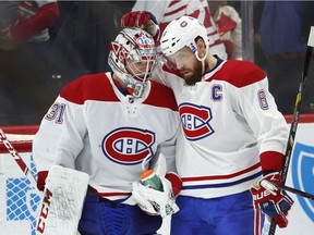 Canadiens goalie Carey Price celebrates with captain Shea Weber after 8-1 win over the Red Wings in Detroit on Tuesday, Feb. 26, 2019.