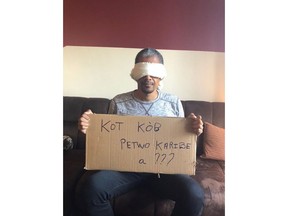 Gilbert Mibrambeau Jr. is seen in this undated handout photo. In a photo posted to Twitter last summer, Gilbert Mirambeau Jr. sits on a couch in Montreal, wearing a blindfold and holding up a handwritten cardboard sign written in Creole that reads: "Where is the PetroCaribe money?" The now-viral photo, posted on Aug. 14 to commemorate the date of a 1791 slave uprising, served as a catalyst for a series of massive street protests that are fuelled by social media and frustration over the rising cost of living and the alleged disappearance of billions of dollars from an oil subsidy program intended to help the impoverished Haitian people.