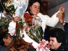 Speedskating gold medallist Angela Cutrone, 23, of St-Léonard, is greeted by family and friends at Mirabel Airport Feb. 24, 1992, upon her return from the winter Olympics. She was a member of the team that won the 3,000-metre relay. This photo appeared on Page 1 of the Montreal Gazette on Feb. 25, 1992.