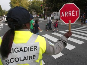 A traffic safety researcher told Thursday's committee hearing that the presence of crossing guards often convinces parents to send their children to school by foot because they feel safer.