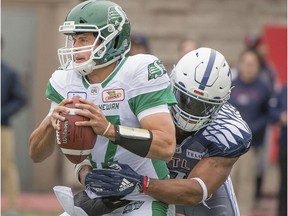 Montreal Alouettes' John Bowman sacks Saskatchewan Roughriders' Zach Collaros in Montreal on Sept. 30, 2018.