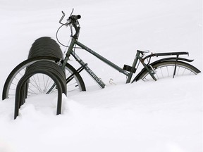 A bicycle and bike rack buried in snow on the grounds of the University of Montreal on March 10, 2008, after a massive snowstorm dumped over 30cm on the city.