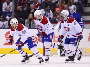 Canadiens' Andrew Shaw (65) heads to the bench with teammates Brett Kulak (17) and Paul Byron (41) after scoring on Toronto Maple Leafs goaltender Frederik Andersen during in Toronto on Saturday, Feb. 23, 2019.