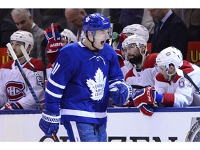 Toronto Maple Leafs' Zach Hyman celebrates his goal and the Leafs' fourth goal as the Canadiens' bench look on in the third period  in Toronto on Saturday, Feb. 23, 2019.