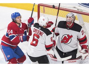 All eyes on the prize: Canadiens' Charles Hudon (54) moves in on New Jersey Devils goaltender Mackenzie Blackwood as Devils' Andy Greene defends in Montreal on Saturday, Feb. 2, 2019.
