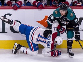 Canadiens' Brendan Gallagher is checked by Ducks' Brandon Montour during second period Tuesday night at the Bell Centre.