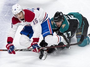 Montreal Canadiens' Jesperi Kotkaniemi is taken down by Anaheim Ducks' Rickard Rakell during first period in Montreal on Tuesday, Feb. 5, 2019.