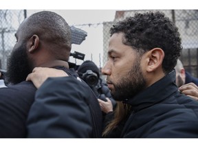 "Empire" actor Jussie Smollett leaves Cook County jail following his release, Thursday, Feb. 21, 2019, in Chicago. Smollett was charged with disorderly conduct and filling a false police report when he said he was attacked in downtown Chicago by two men who hurled racist and anti-gay slurs and looped a rope around his neck, a police official said.