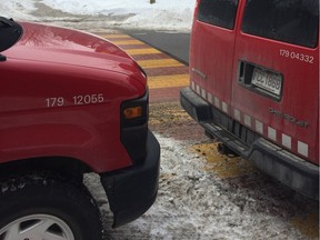 These two City of Montreal vans were parked almost bumper-to-bumper on des Seigneurs St., blocking a crosswalk between École de la Petite Bourgogne and the Little Burgundy Sports Centre.