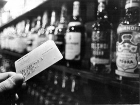This photo by George Cree was used to illustrate a story in the Montreal Gazette Feb. 7, 1974 about the Quebec Liquor Corp. (SAQ) having begun to allow the purchase of liquor on credit at its location in the Bay store downtown. Only the Bay credit card was accepted.