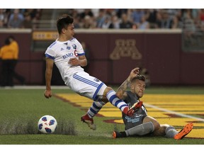 Minnesota United defender Francisco Calvo, right, takes the ball from Montreal Impact midfielder Ken Krolicki during the second half of an MLS soccer match Saturday, May 26, 2018, in Minneapolis. (Anthony Souffle/Star Tribune via AP) ORG XMIT: MNMIT339