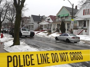 Milwaukee Police cars are stationed in a neighborhood where Milwaukee Police Officer Matthew Rittner was killed Thursday, Feb. 7, 2019.