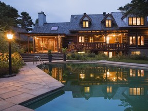 The lighting at the back of the housem reflected in the in-ground pool at dusk, makes for a spectacular visual effect.