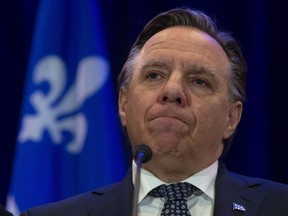 Limiting the wearing of religious symbols for authority figures would be "like drawing a line in the sand" for those who would want a ban to extend further, says Quebec Premier François Legault.