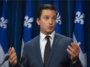 Coalition Avenir Quebec MNA Simon Jolin-Barrette responds to reporters questions on Tuesday, October 9, 2018 at the legislature in Quebec City.