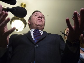 Quebec Premier Francois Legault responds to reporters questions on immigration, Tuesday, February 26, 2019 at the legislature in Quebec City.