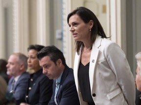 Quebec Junior Education Minister and Minister responsible for the status of Women Isabelle Charest responds to the Opposition during question period Wednesday, February 6, 2019 at the legislature in Quebec City. Charest said this week that she considered hijabs to be oppressive.