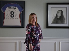 Lori Alhadeff, mother of 14-year-old Alyssa Alhadeff who was one of 17 people killed at Marjory Stoneman Douglas High School, stands for a portrait in her home, on Wednesday, Jan. 30, 2019, in Parkland, Fla. The day of the shooting, she approached a line of reporters. She did not know what to say. But she felt compelled to speak. "A crazy person just walks right into the school, knocked on the window of my child's door and starts shooting, shooting her and killing her," she screamed. "President Trump, you say what can you do, you can stop the guns from getting into these children's hands, put metal detectors at every entrance to the school."