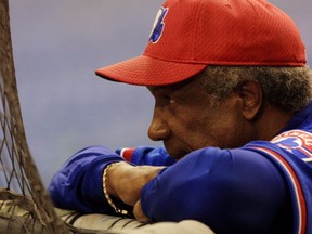 Montreal Expos Manager Frank Robinson watches his troops practice for the 2002 Opening Day game against the Florida Marlins at the Olympic Stadium.