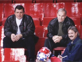 Former Canadiens general manager Serge Savard (left) sits in stands at the old Montreal Forum along with his assistant André Boudrias and reporter Pierre Durocher of the Journal de Montréal in this Montreal Gazette file photo.