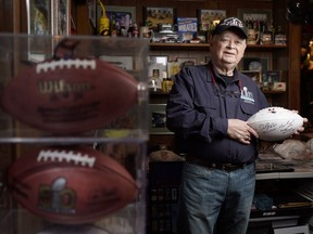 Don Crisman poses for a photo in his Kennebunk, Maine, home on Monday, Jan. 28, 2019, holding a Super Bowl LI ball signed by a few Patriots NFL football players. Crisman has never missed a Super Bowl and will be heading to Atlanta to watch his 53rd Super Bowl as the Patriots take on the Chiefs.
