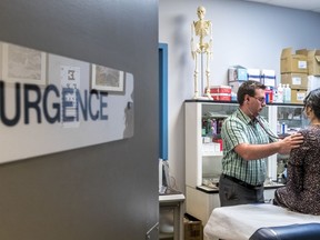 Nurse Practitioner Yannick Melancon Laitre, affectionately referred to as a "super nurse," attends to a patient at a family medicine clinic in Berthierville, on Thursday, April 12, 2018.